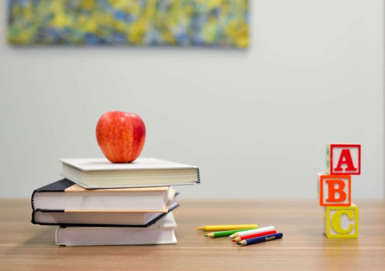 Colorful backpacks and school supplies arranged for distribution
