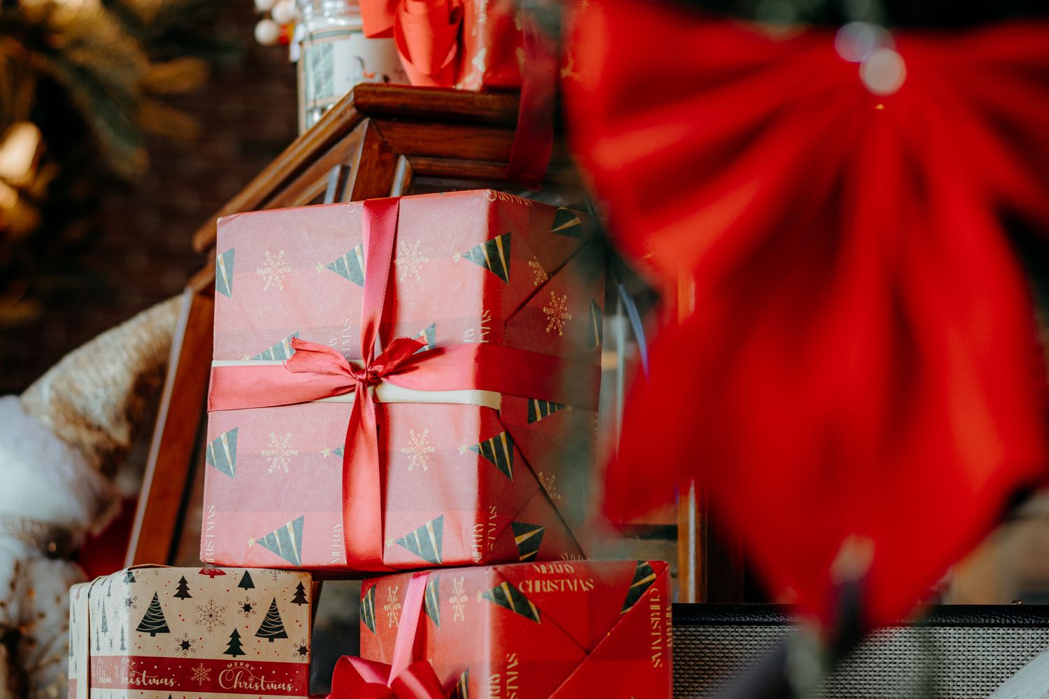 Colorfully wrapped presents with ribbons stacked for a gift exchange