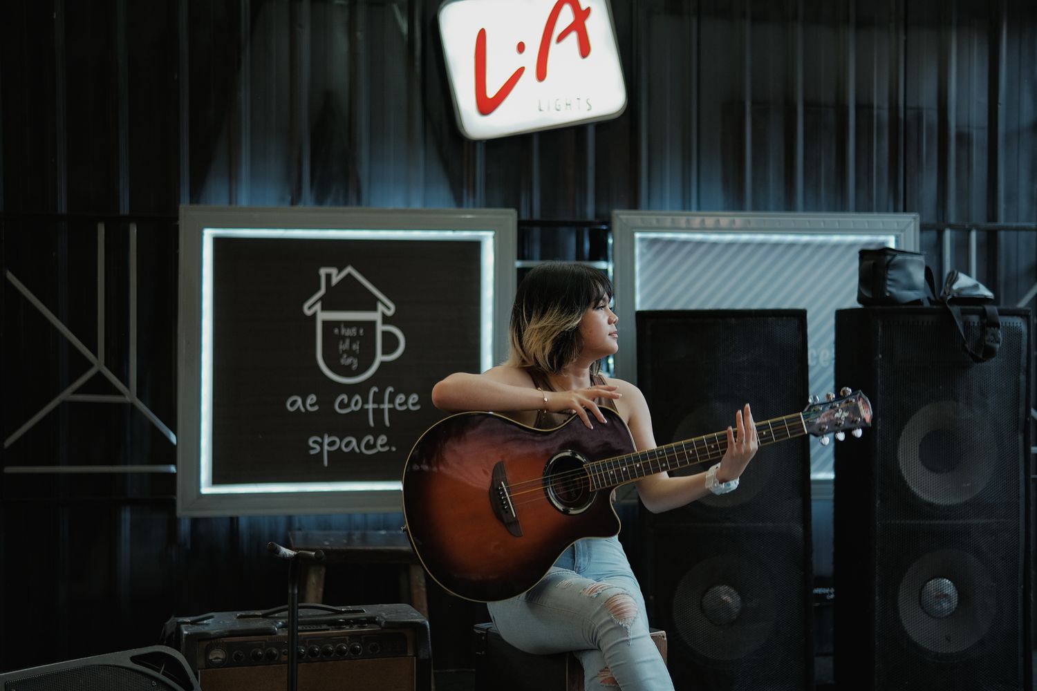 Acoustic musician performing live in a coffee shop