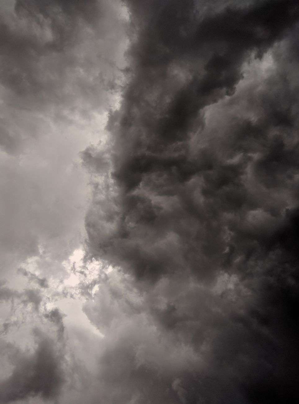 Dark, intense storm clouds filling the sky ahead of severe weather