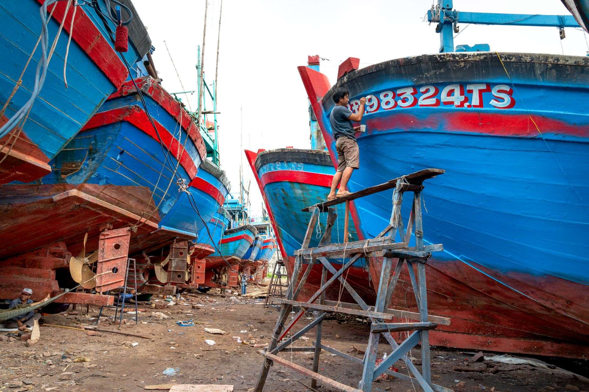 Shipyard workers on a maritime industrial site