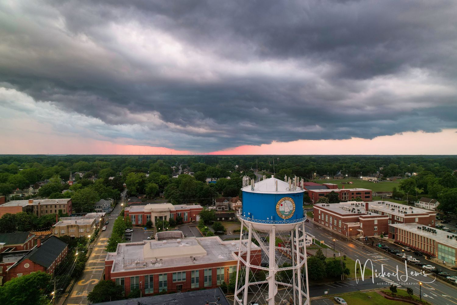 Dark storm clouds over a small Southern town