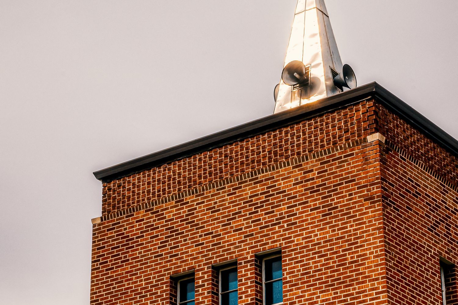 Exterior of a historic church building with a steeple in Mobile, Alabama