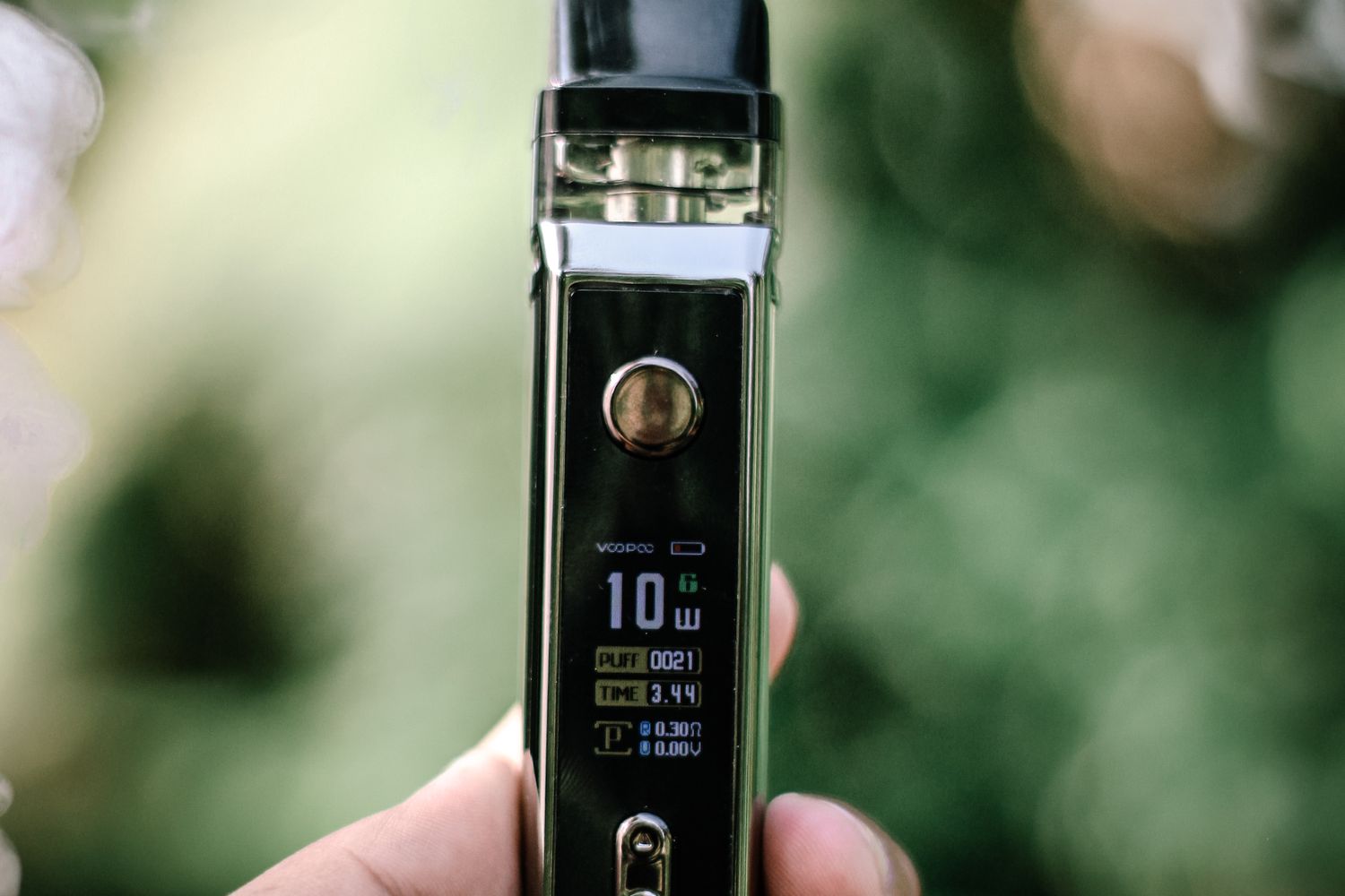 A close-up of an electronic cigarette vaping device resting on a table