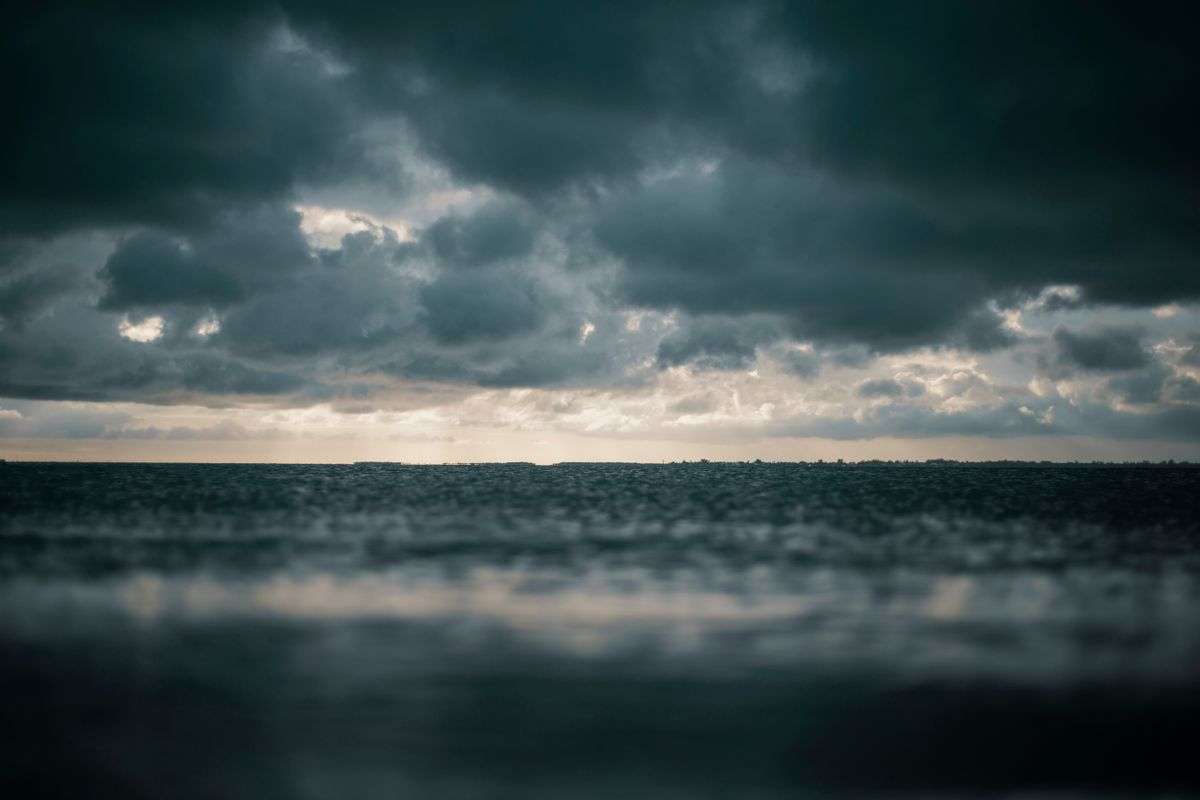 Dark, churning storm clouds over water as a hurricane approaches the Gulf Coast