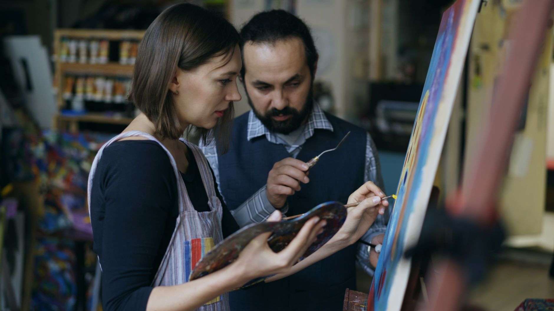 People participating in a painting class