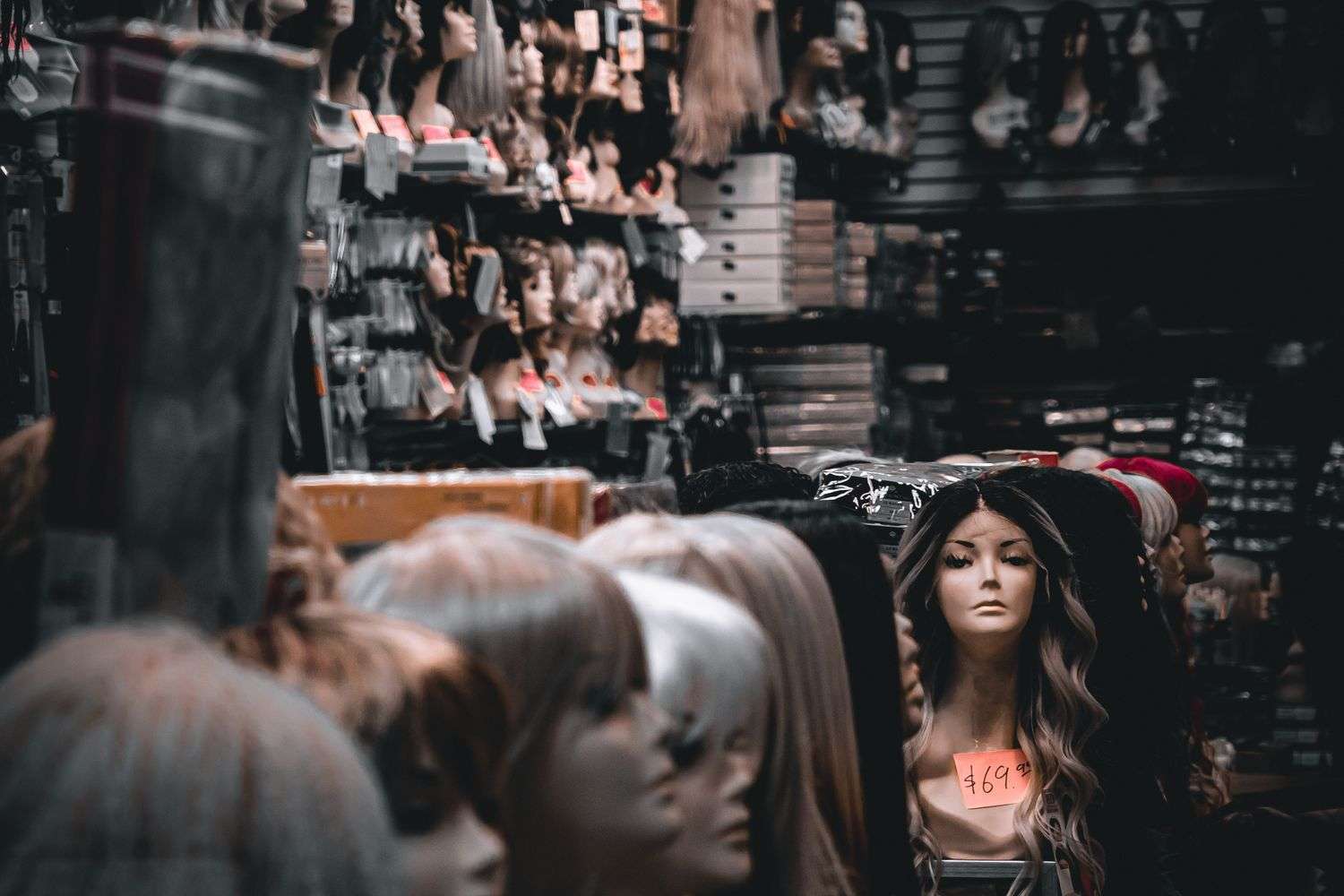 A woman being fitted for a custom medical wig at a boutique in Mobile, Alabama