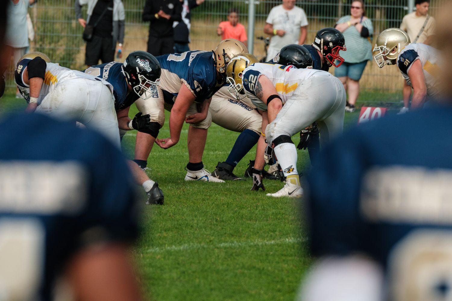 Football players lined up on the field during a game
