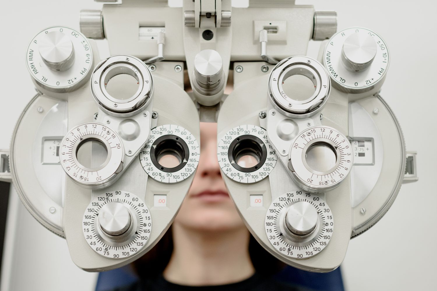 Optometrist giving a patient an eye exam