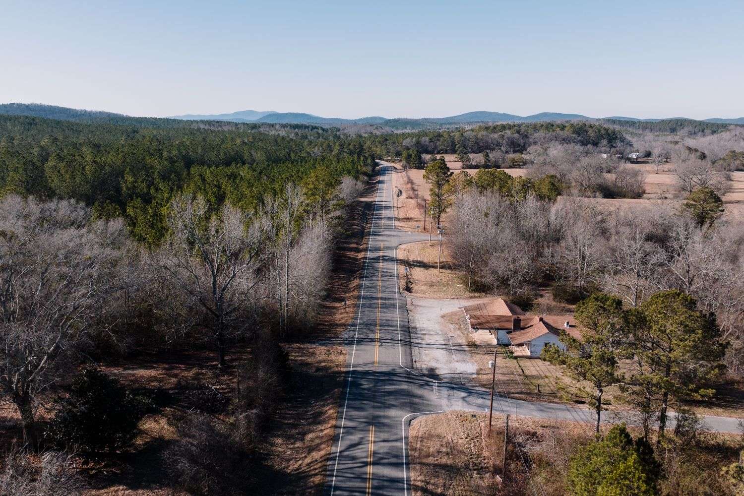 A quiet rural road through a small Alabama community
