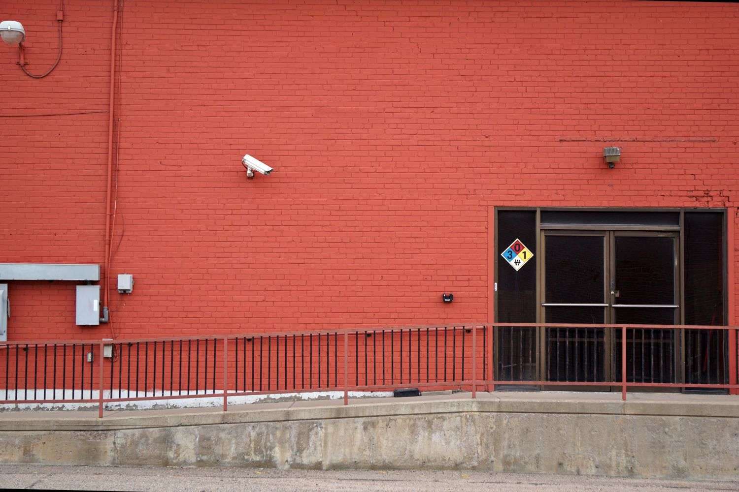 A security camera watching the exterior of a commercial property