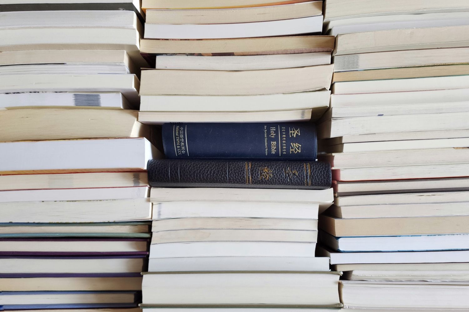 Close-up of a stack of assorted books