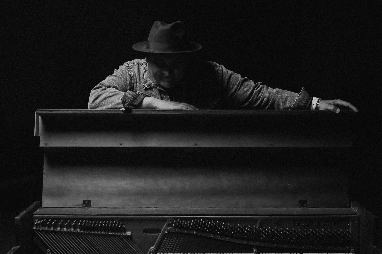 Performer on stage at a historic theater concert in Mobile