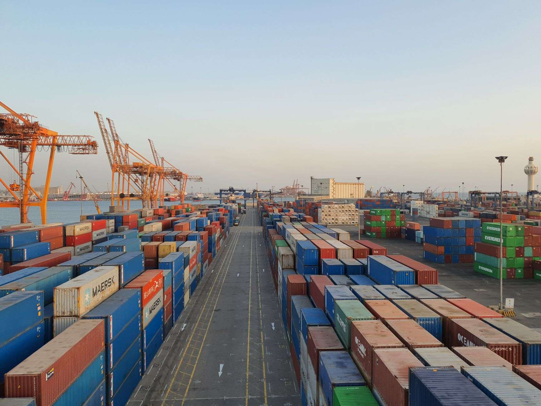 Cargo containers and cranes at a shipping port
