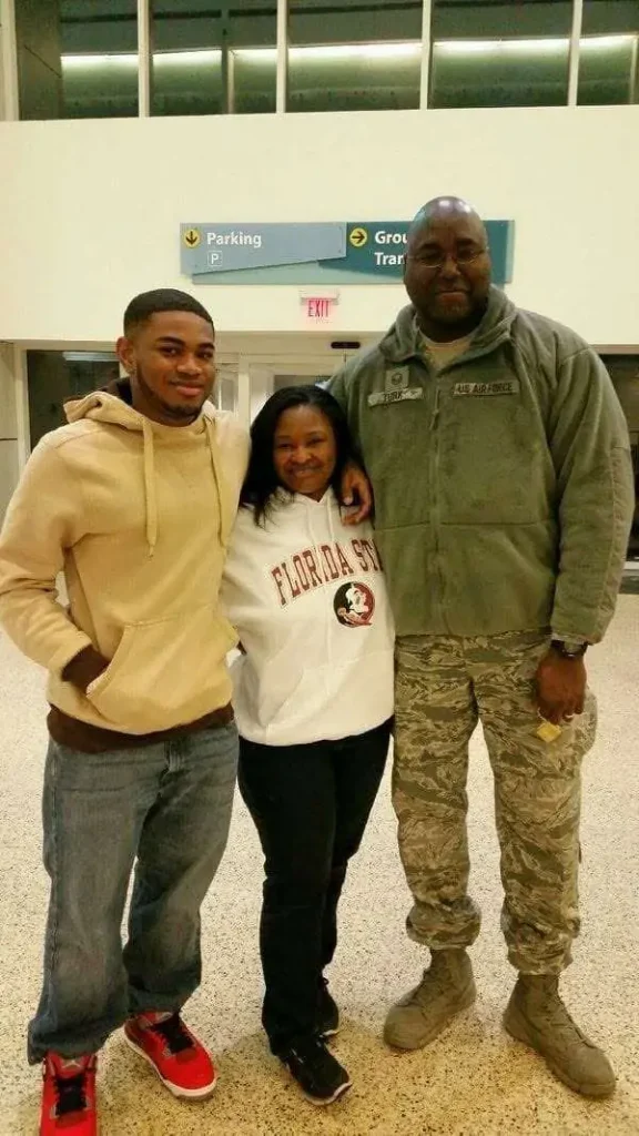 Timothy Turk and wife Tomekia Turk and son Tre Turk