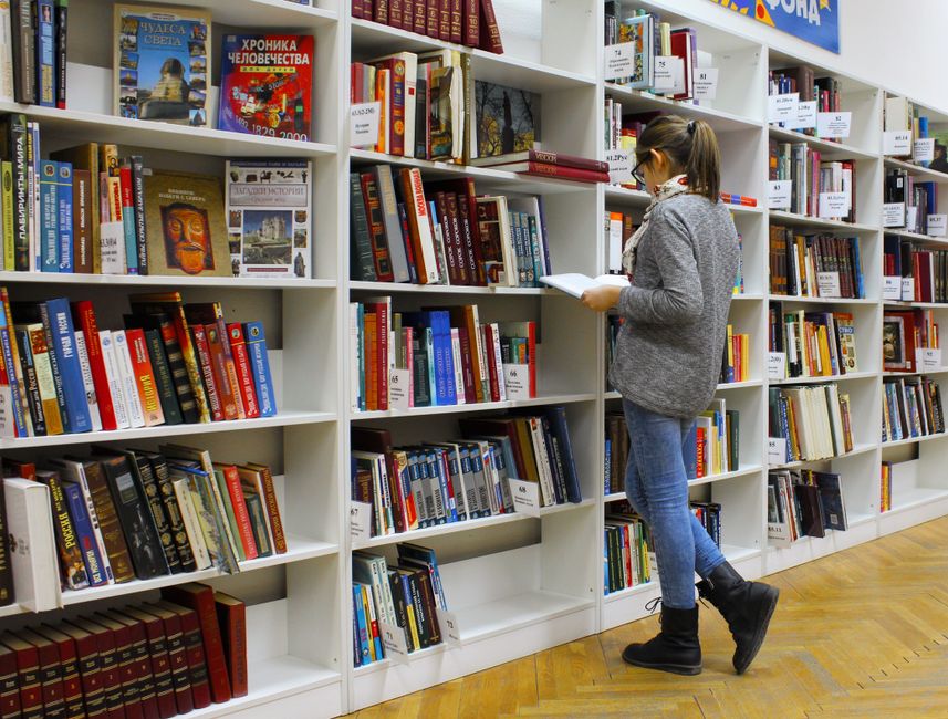 Interior of a university library with modern study spaces and bookshelves