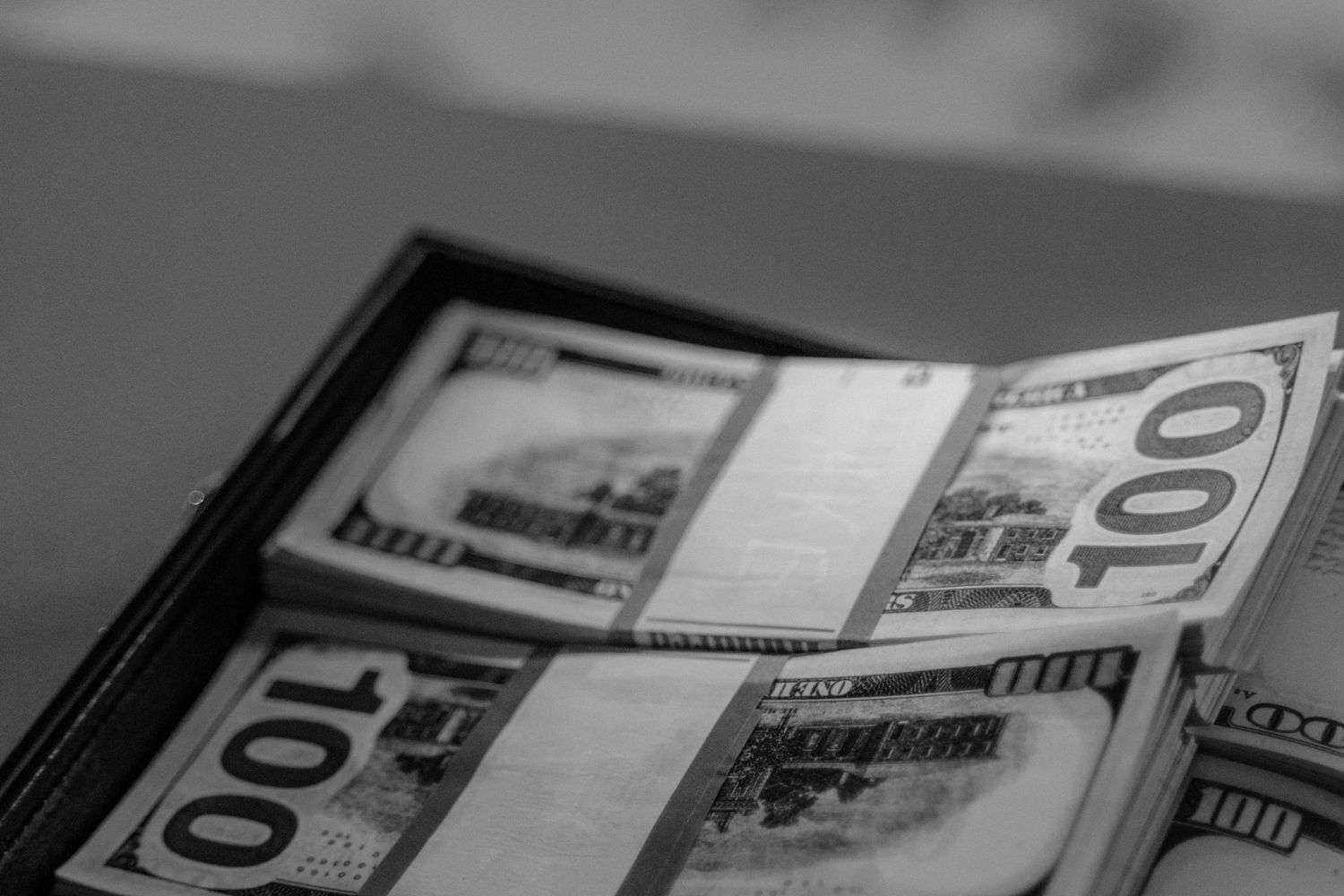 Cash in dollar bills representing unclaimed funds awaiting claimants
