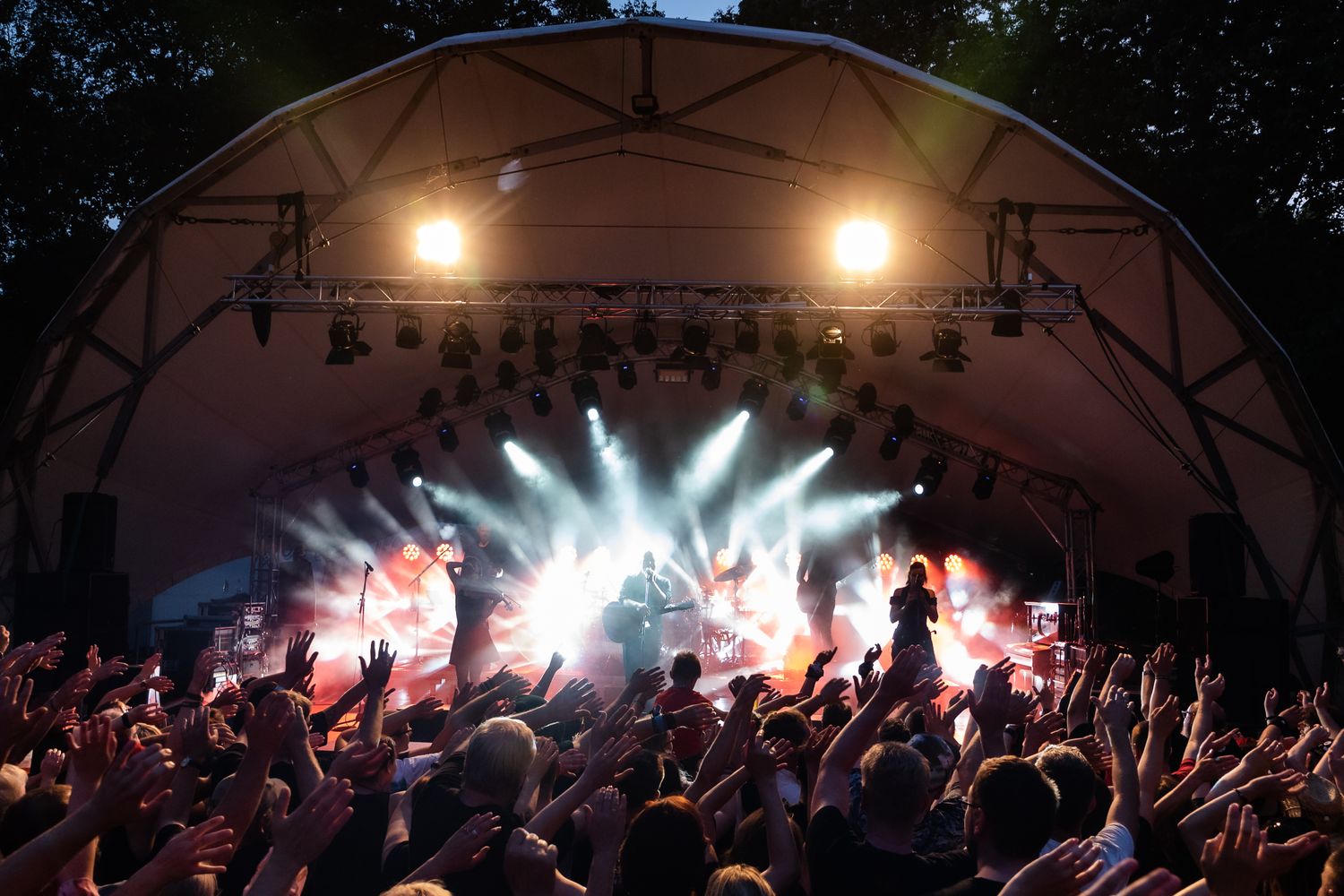 Musicians performing live during a small music festival set