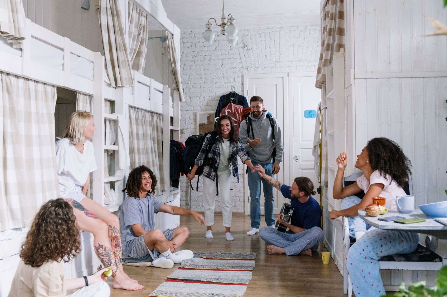 College students and families carrying boxes into a dormitory