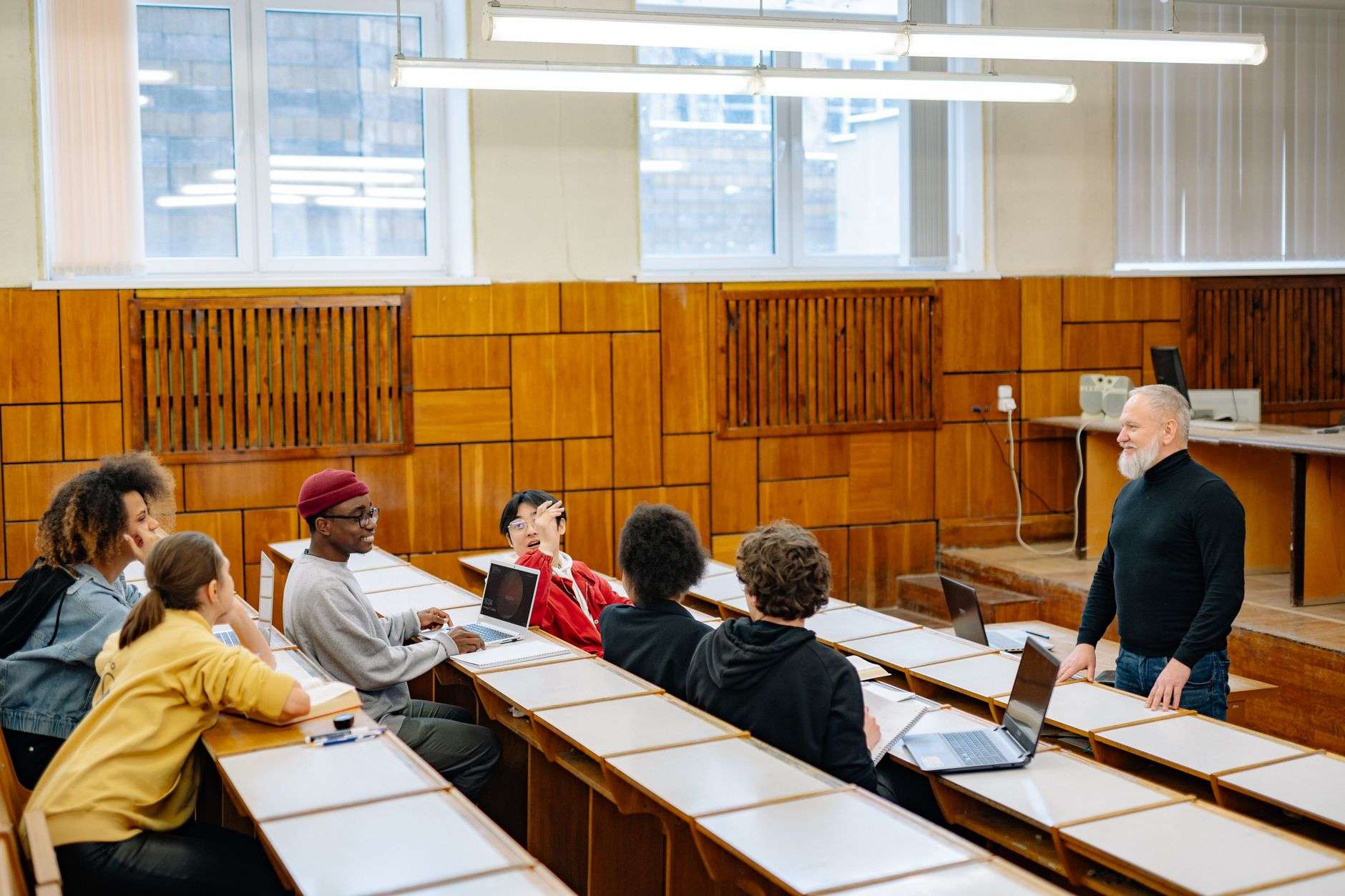 Audience listening to a university panel discussion in an auditorium