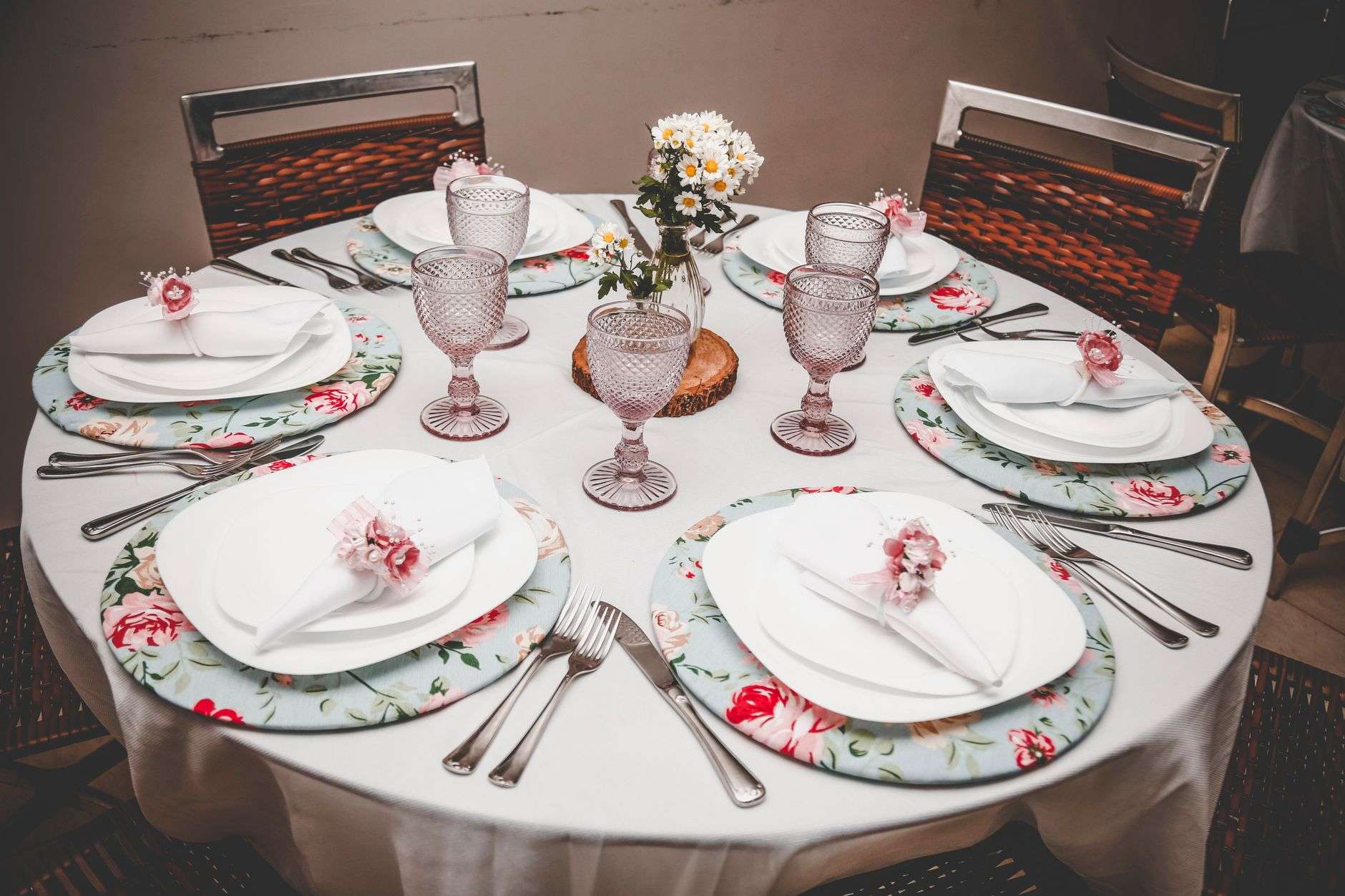 Tables set for a community luncheon event in a banquet hall