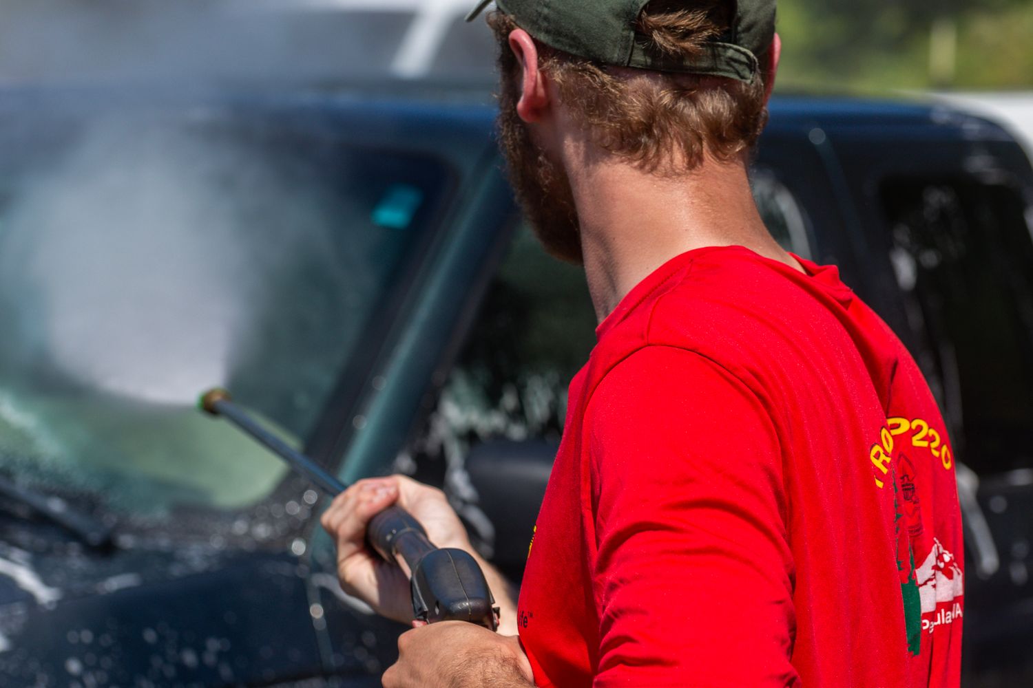 Volunteers washing cars at a community fundraiser in Mobile, Alabama