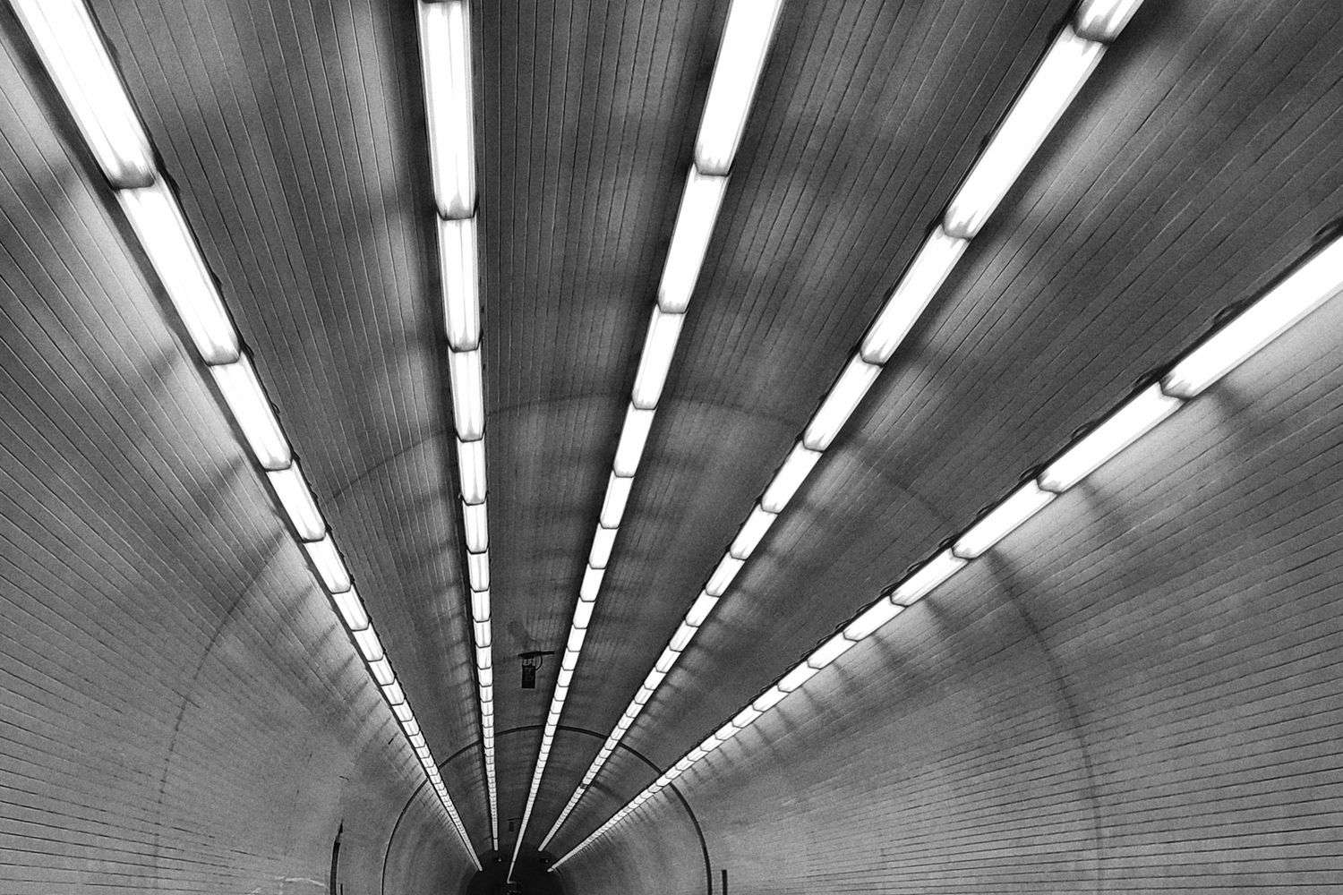Vehicles lined up heading into the Wallace Tunnel in Mobile, Alabama