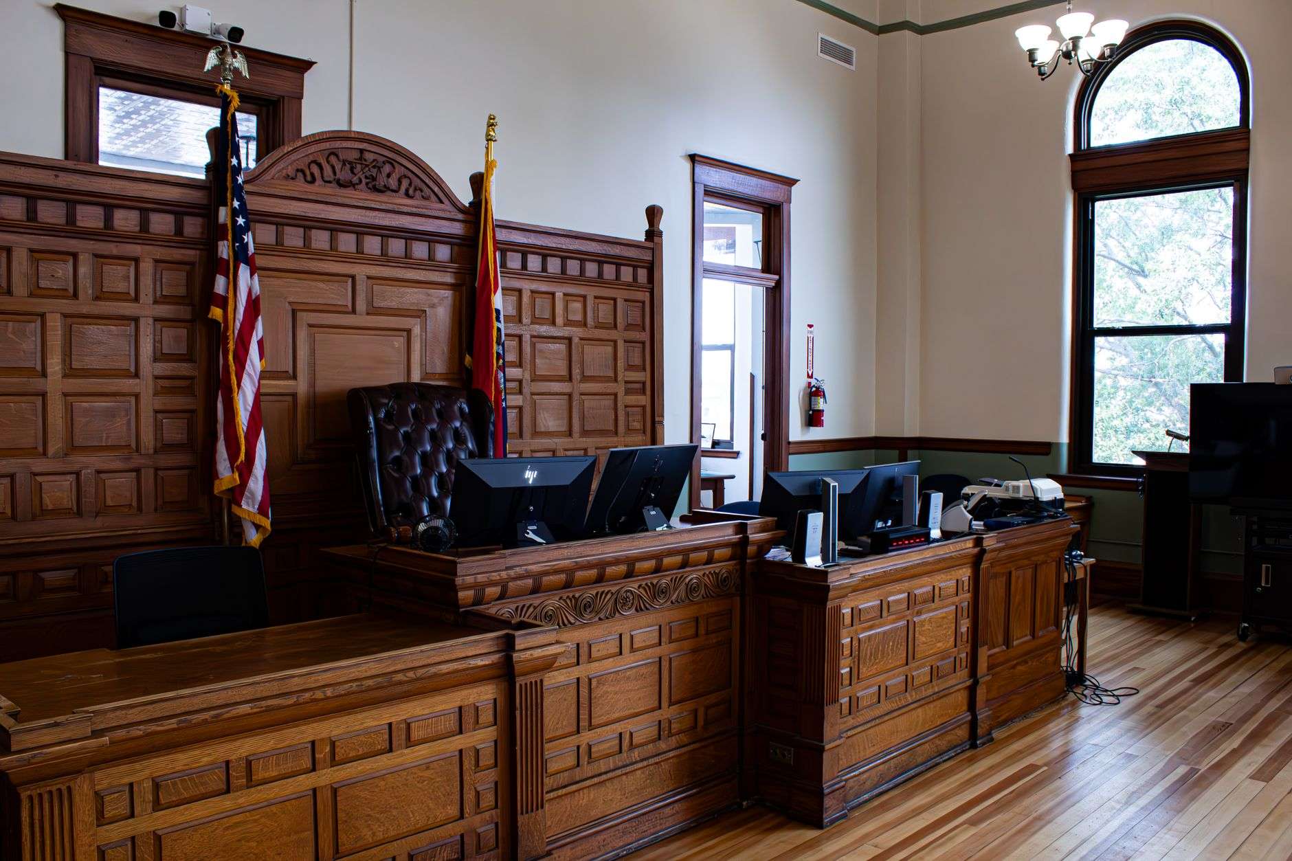 Wooden gavel resting on a courtroom desk symbolizing a criminal court sentencing