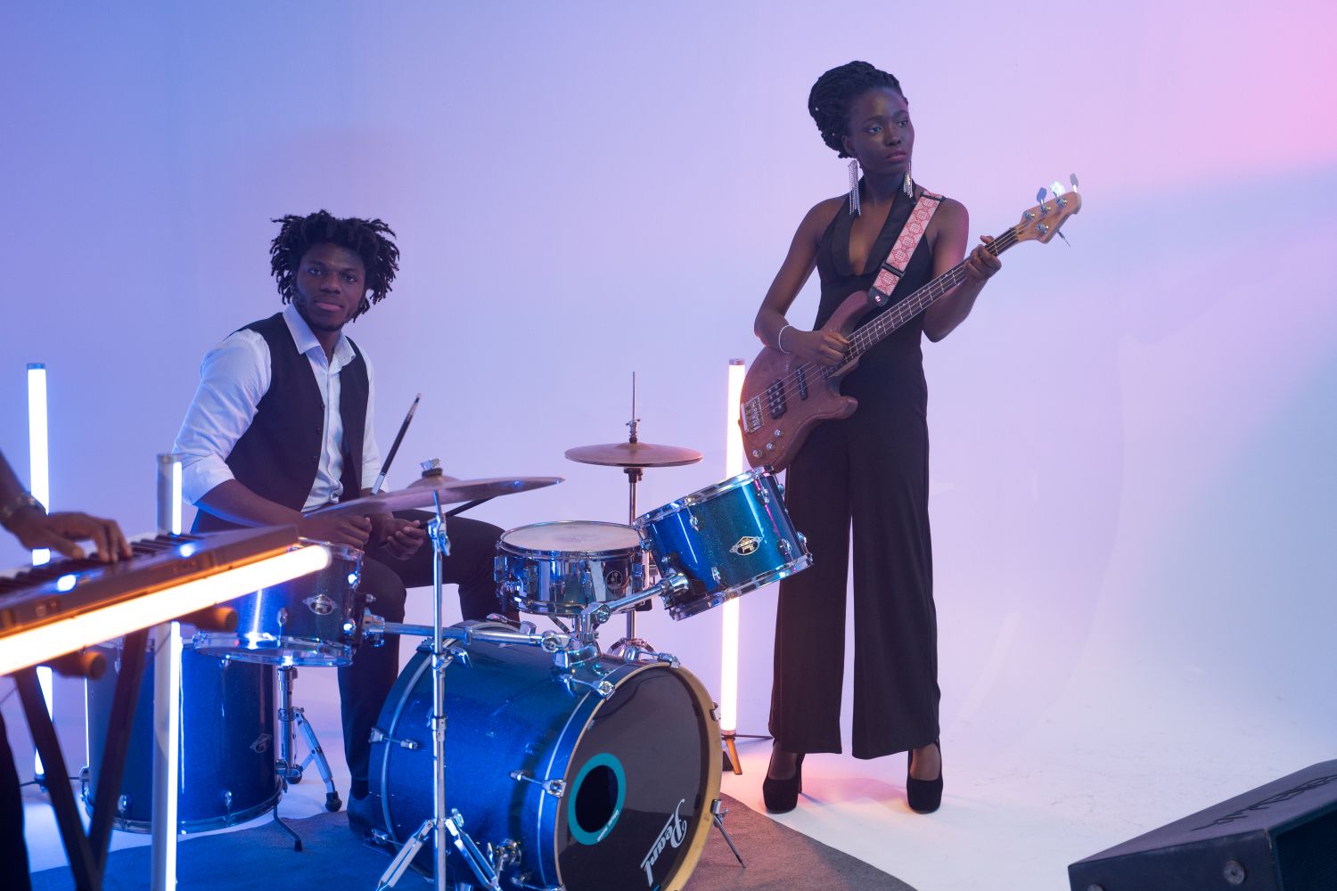 A four-piece funk combo performing live on an outdoor festival stage