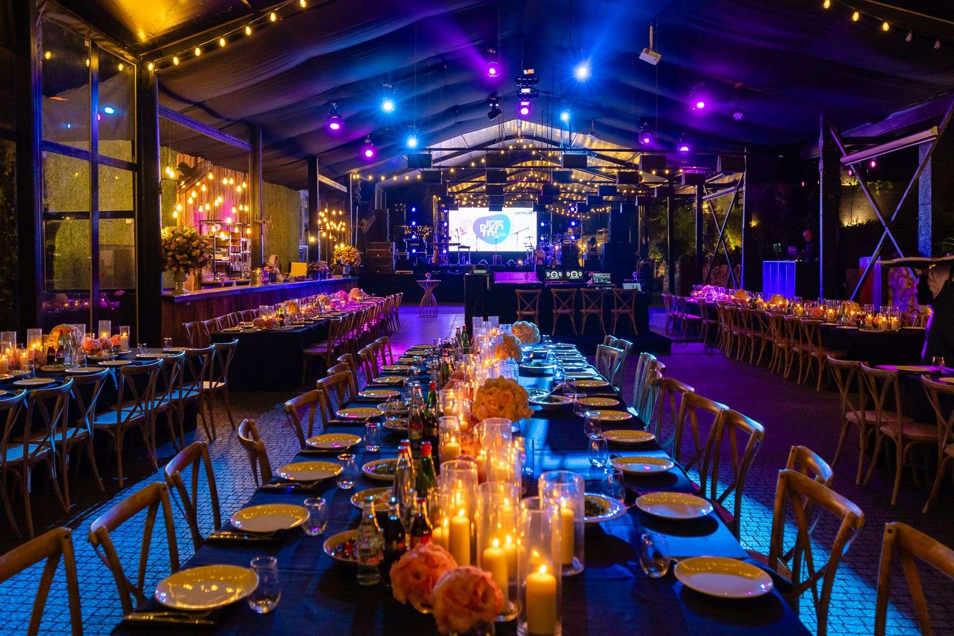 An elegantly set event venue prepared for a formal evening