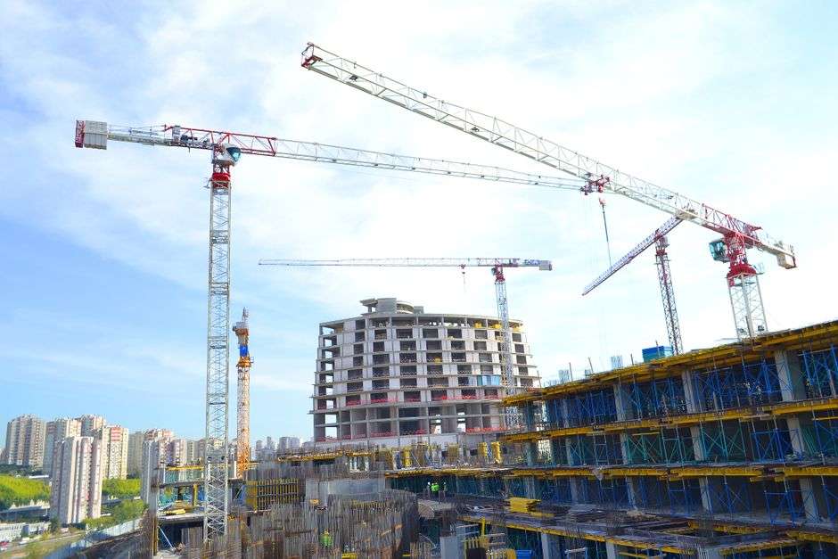 Construction cranes at a new development site in Baldwin County, Alabama