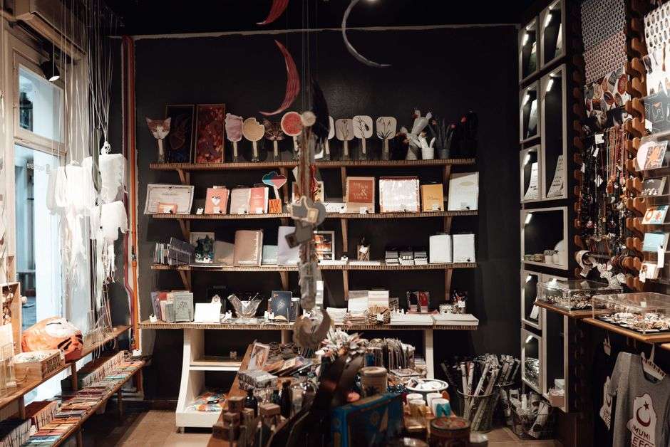 Wooden shelves displaying handmade goods in a boutique shop