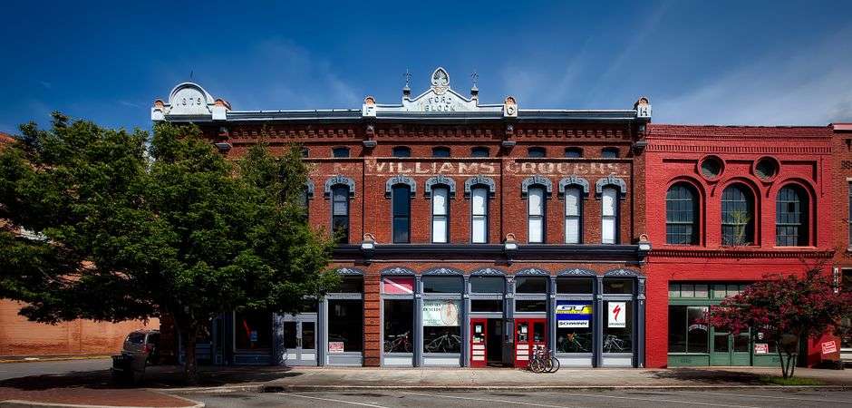 Historic storefronts and streetlights on a revitalized downtown street