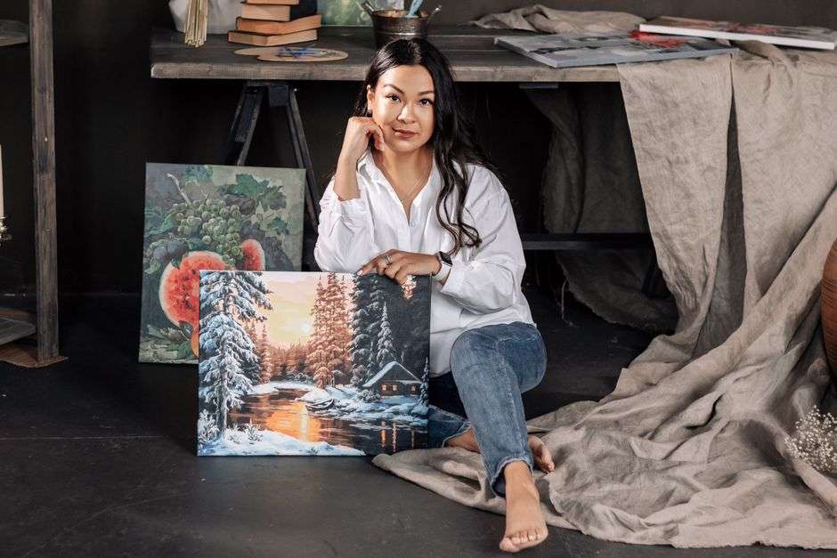Paintings and brushes in an artist's studio