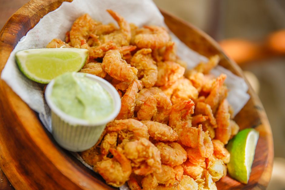 A fried shrimp platter served with sides at a Gulf Coast seafood restaurant