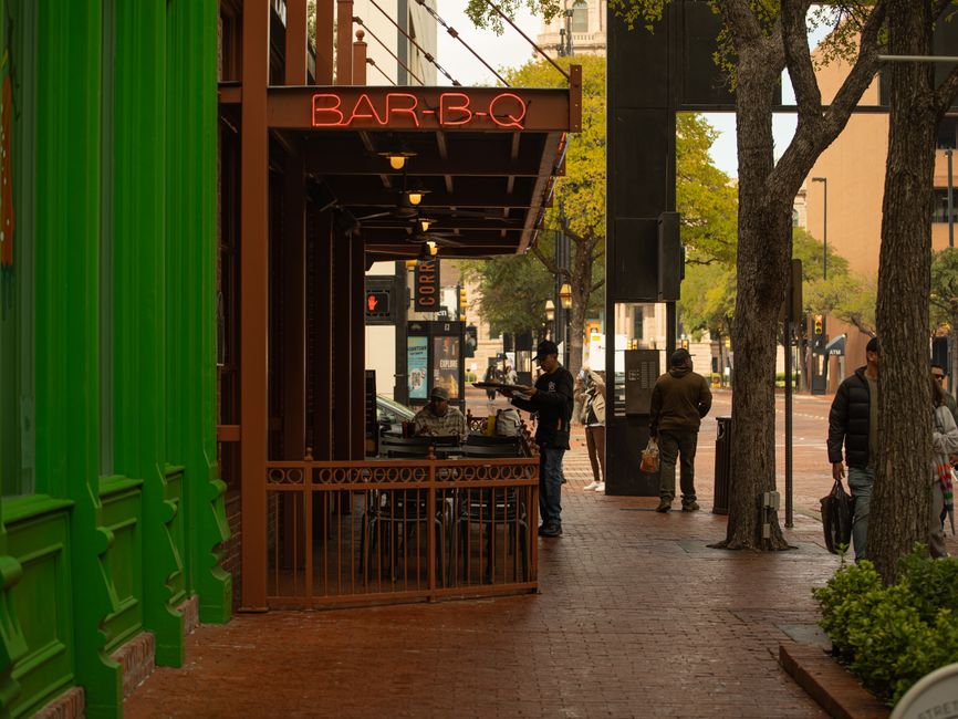 Covered outdoor patio seating at a barbecue restaurant on the Gulf Coast