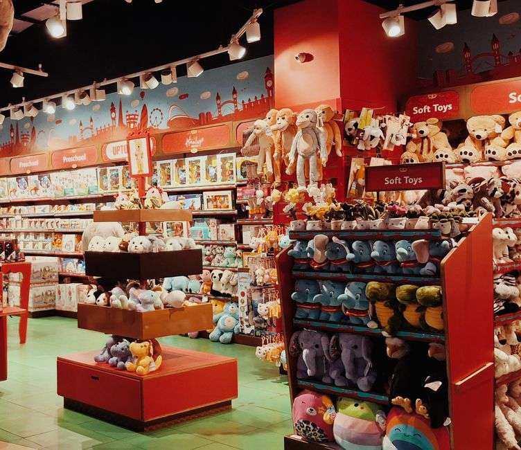 Shelves of colorful toys in a small toy store