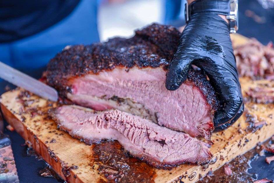 Sliced smoked beef brisket served on butcher paper