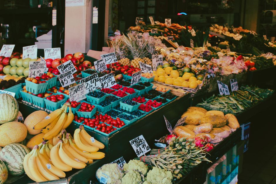 Fresh vegetables and produce on display at a rustic roadside farm market