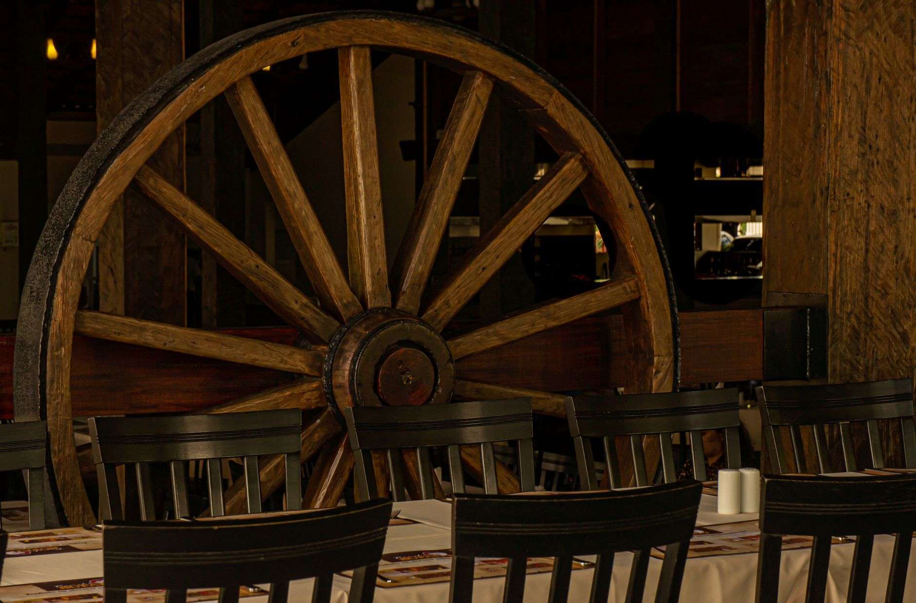 Rustic barn-style restaurant dining room with wooden tables