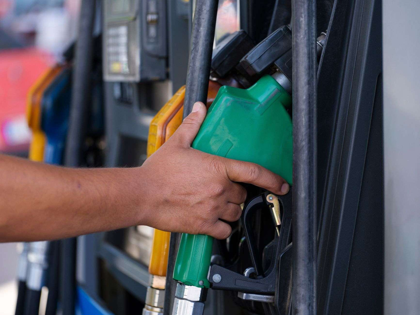 A fuel nozzle and pump at a gas station