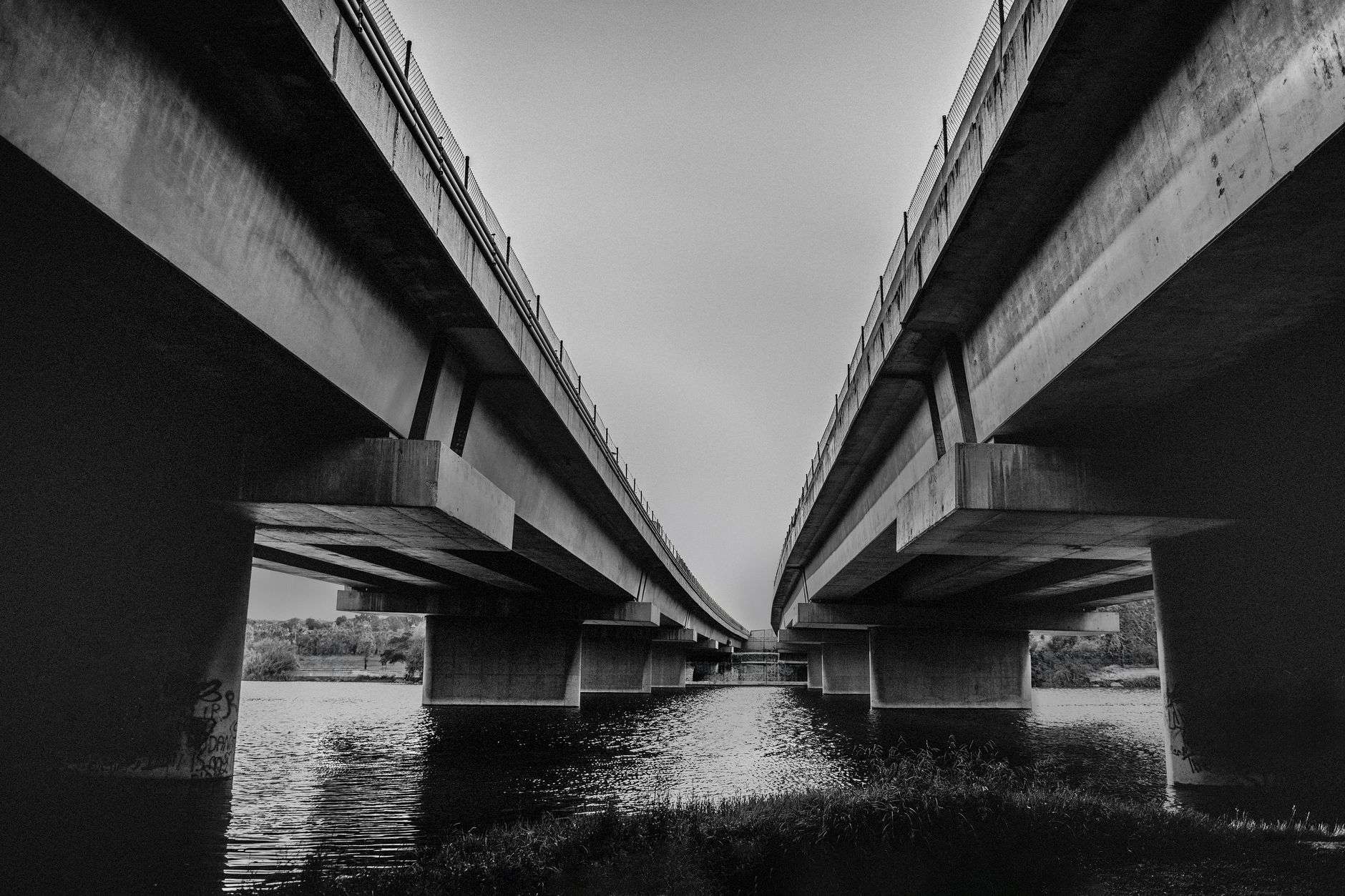 A high-level highway bridge spanning a river shipping channel, illustrating the planned I-10 Mobile River Bridge