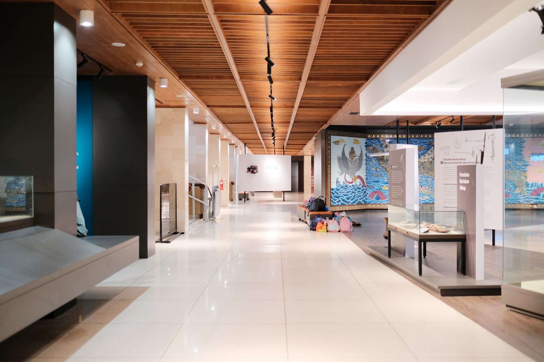 The interior of an art gallery with works displayed on the walls