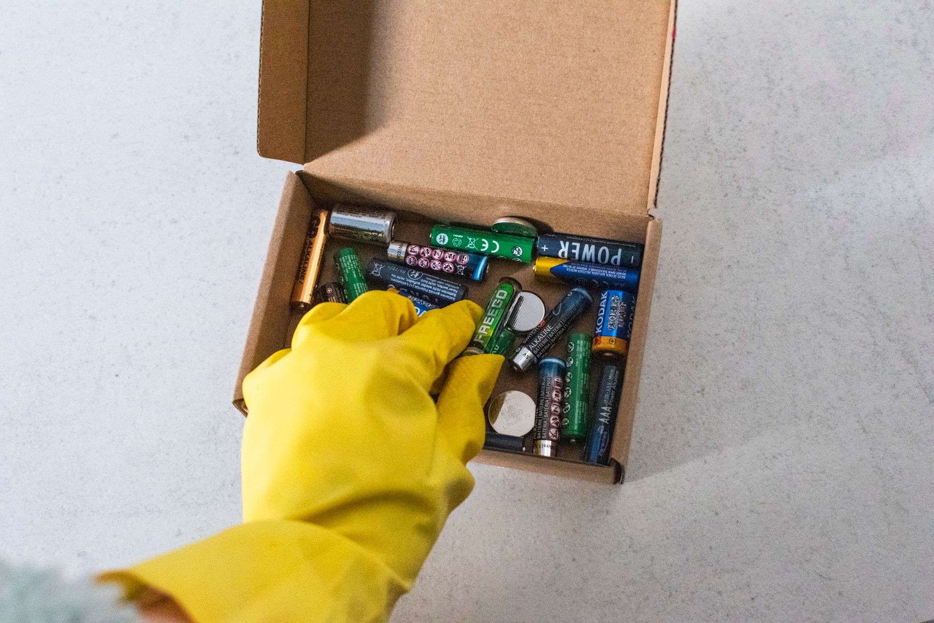 An assortment of used household batteries collected for recycling