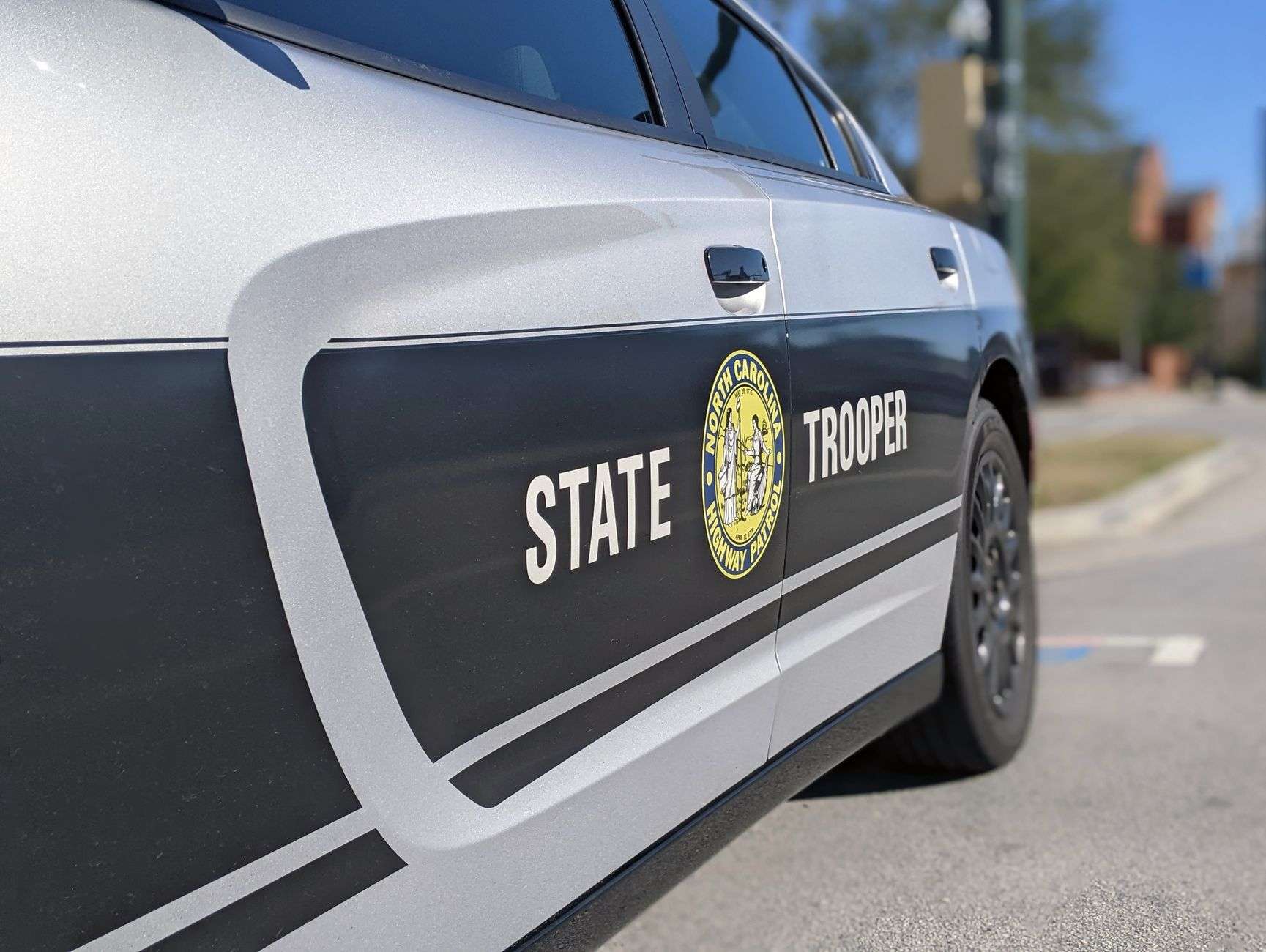 A law enforcement patrol car on a highway