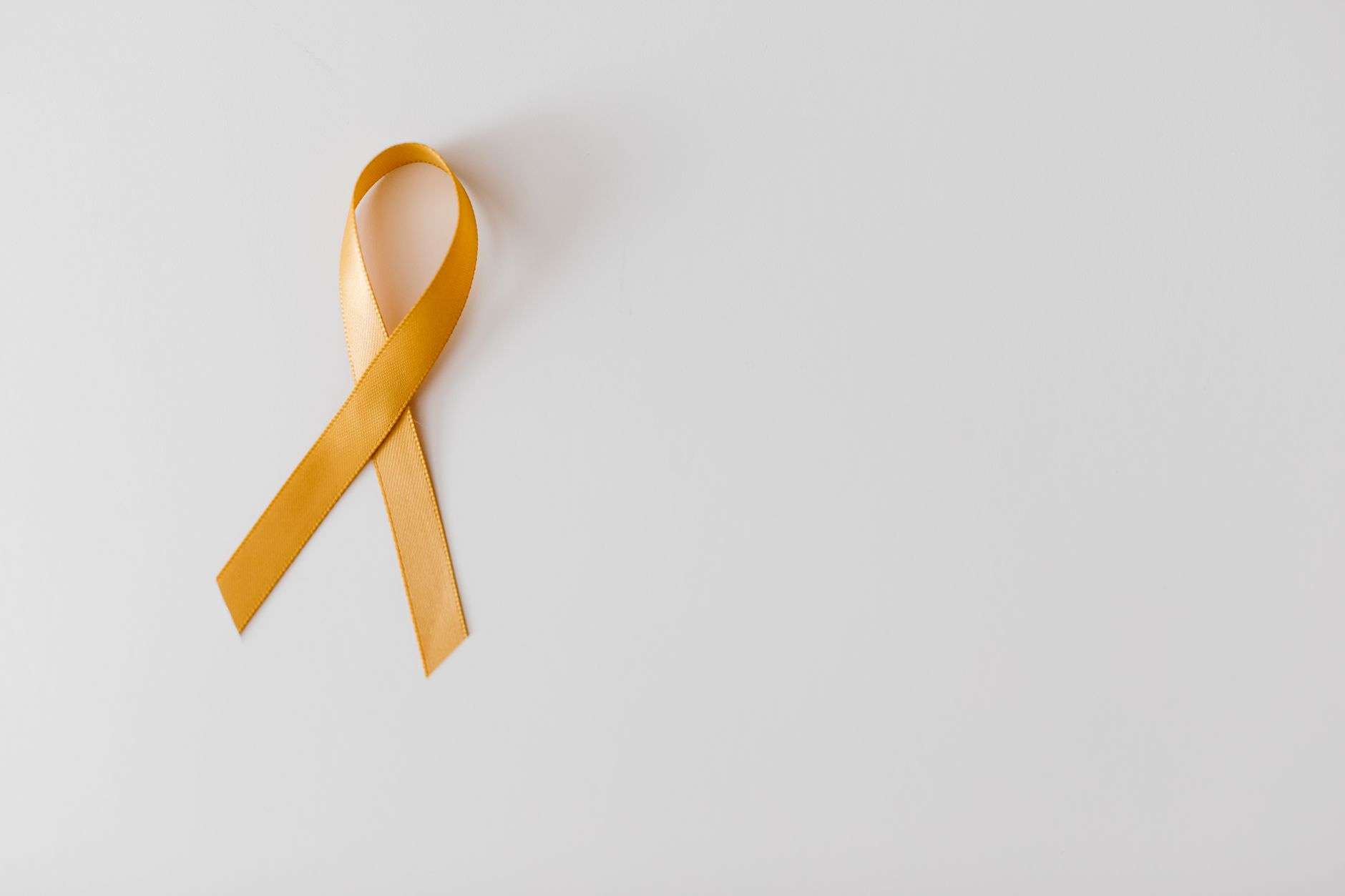 A gold awareness ribbon