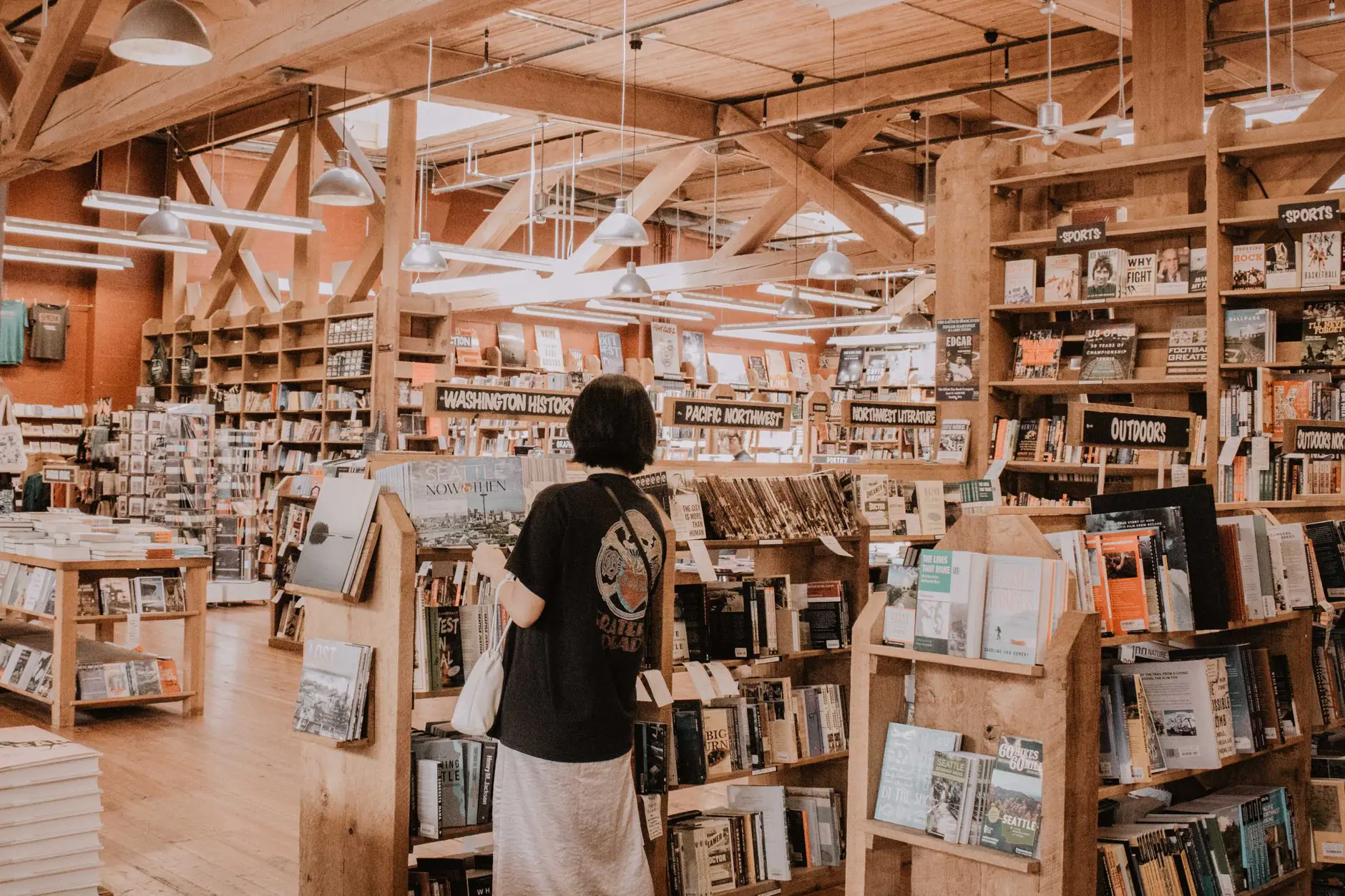 Shelves filled with books inside a cozy independent bookstore