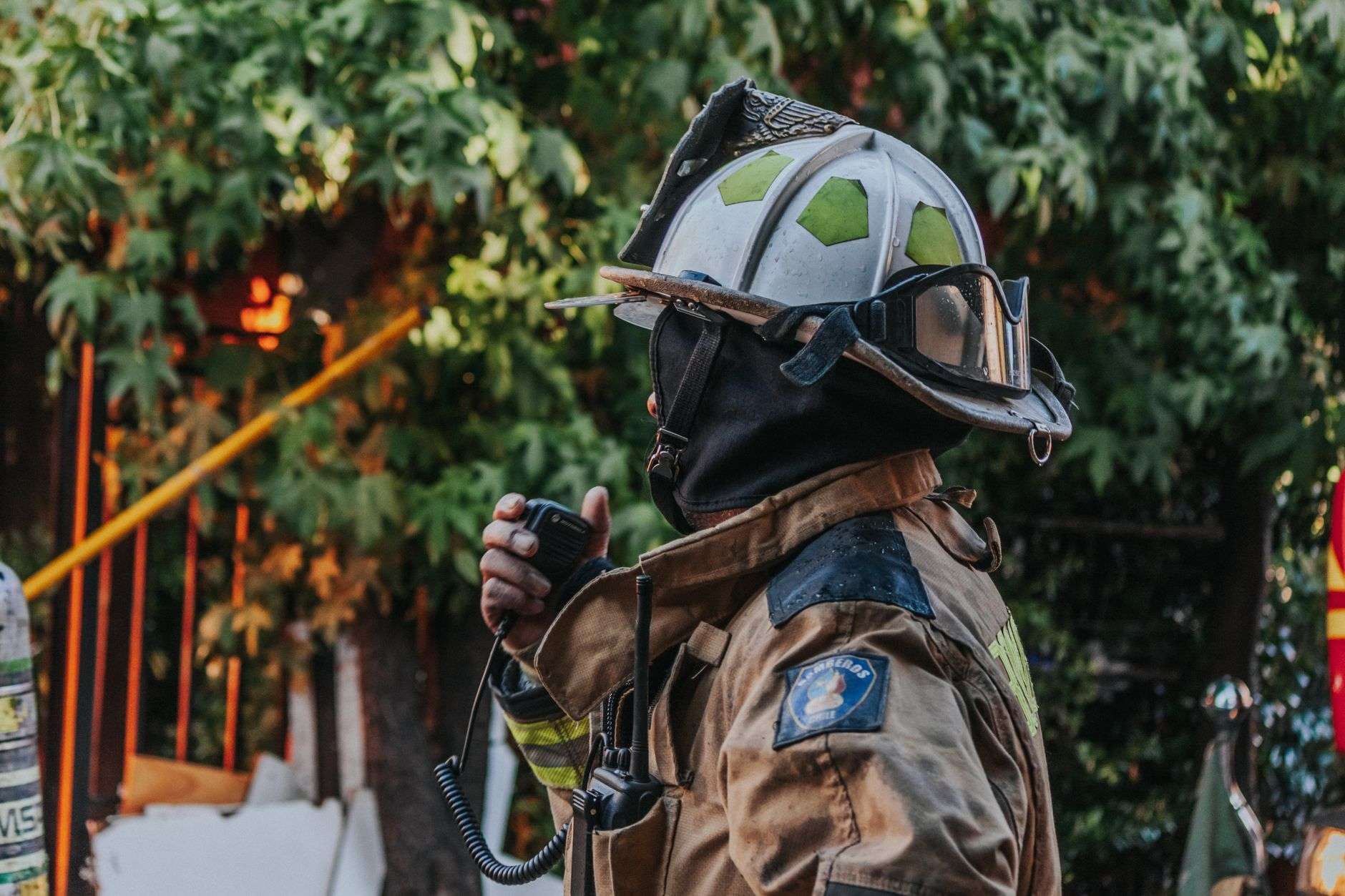 A firefighter's helmet and protective turnout gear