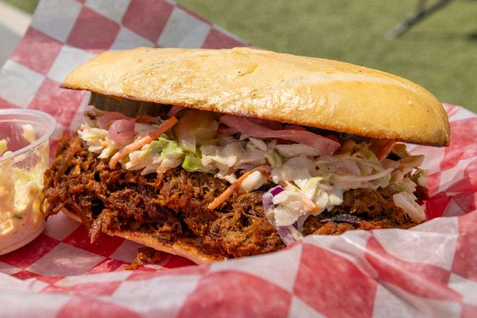 A barbecue platter with pulled pork, ribs and classic Southern sides