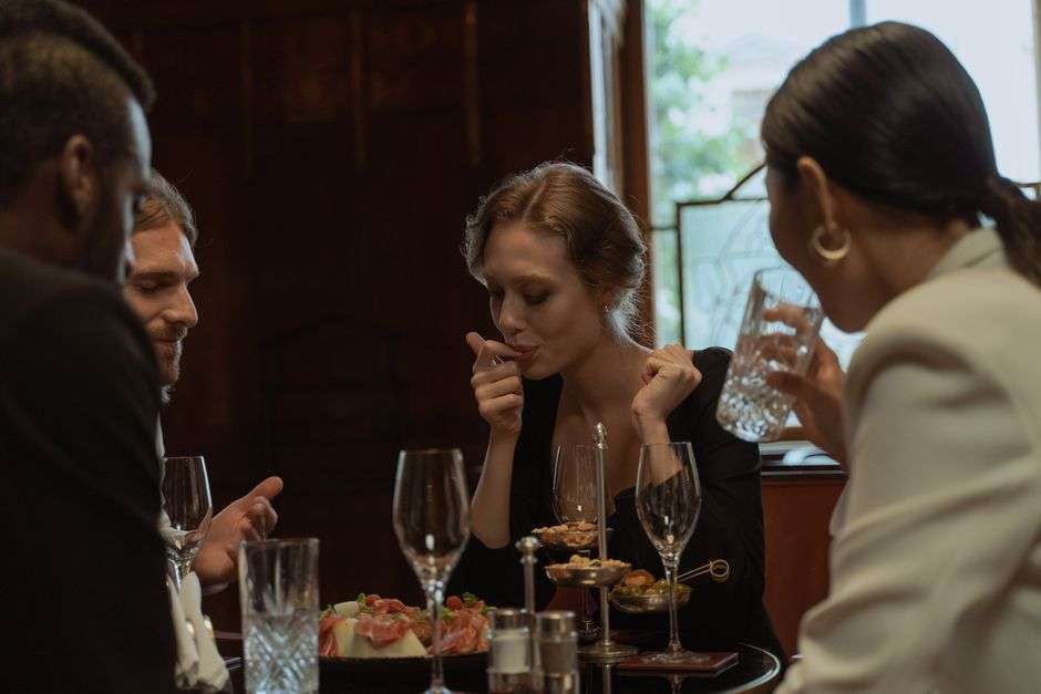 Food tour group sampling signature dishes at a downtown restaurant table